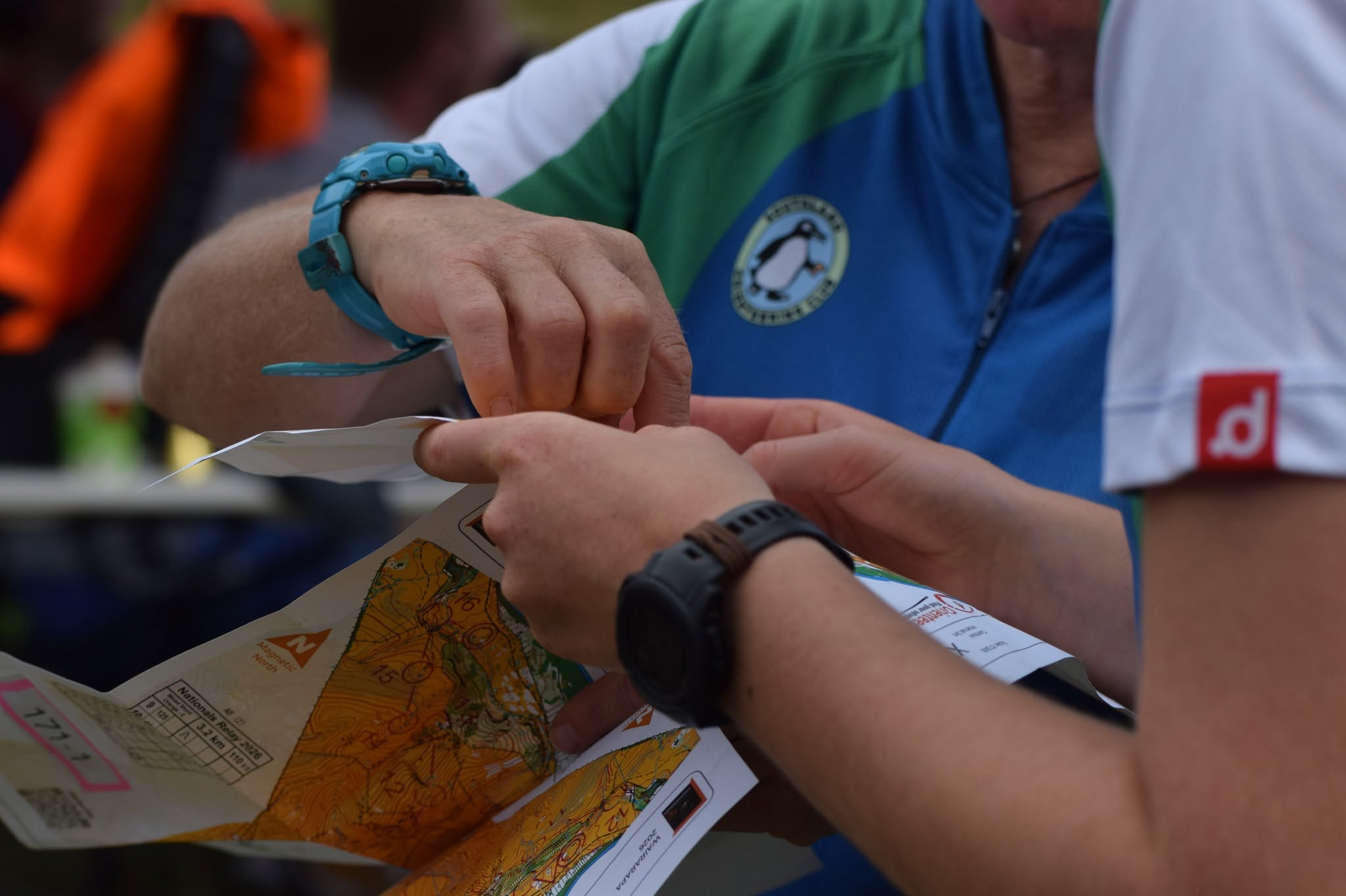 Competitors reviewing their courses together after an event